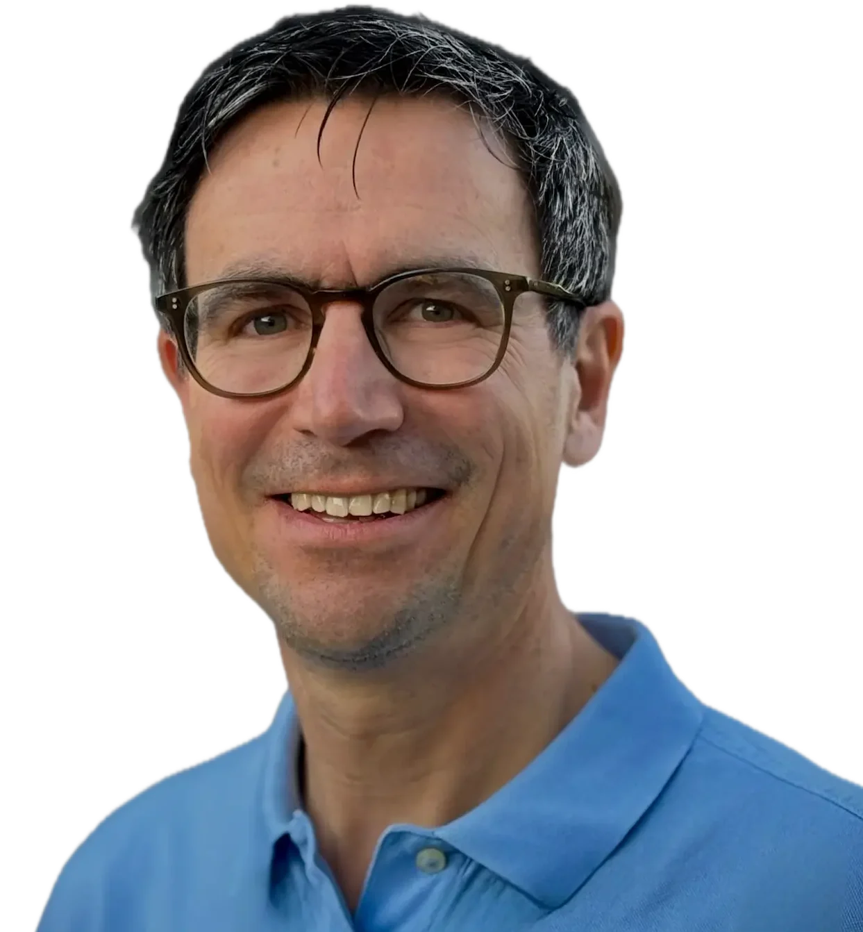 Willkommen bei Dr. Christoph Prandstetter - ihr Kinderkardiologe Mann mit kurzen grau-schwarzen Haaren, Brille, in einem hellen Polohemd lächelt freundlich.